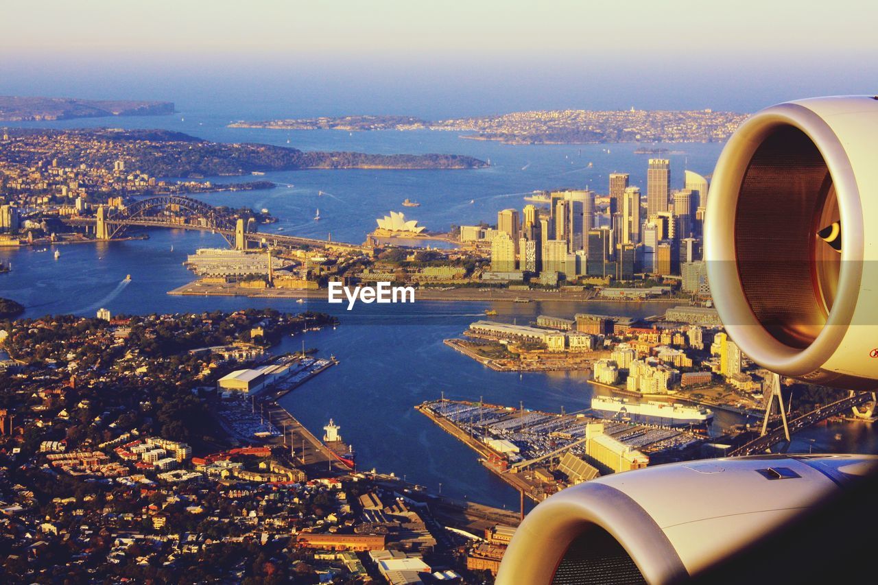 Aerial view of cityscape of sydney against sky