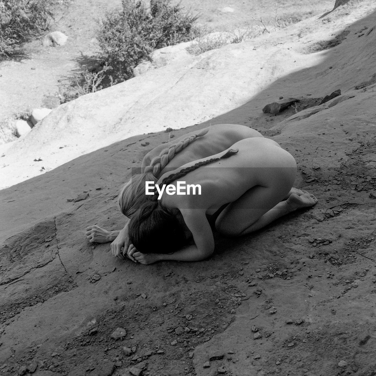 High angle view of woman lying on sand at beach