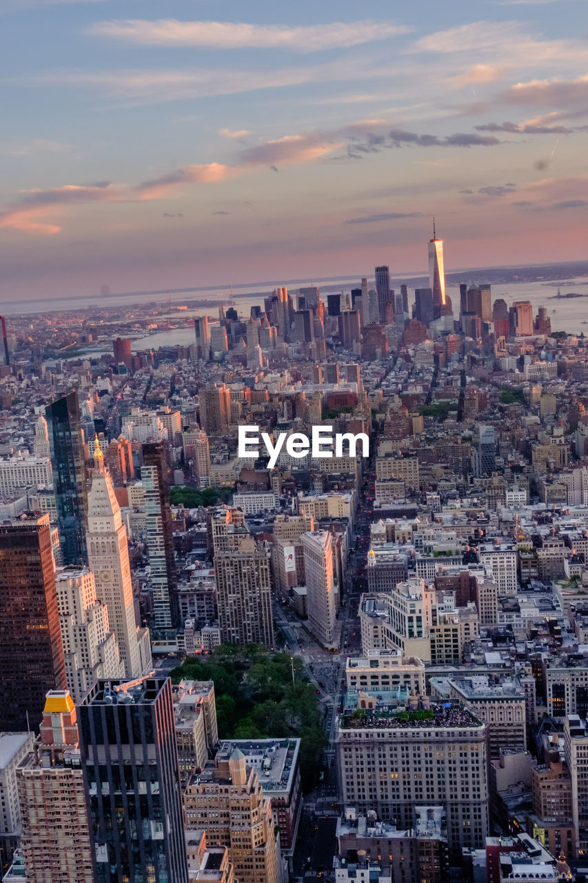 High angle view of city buildings during sunset