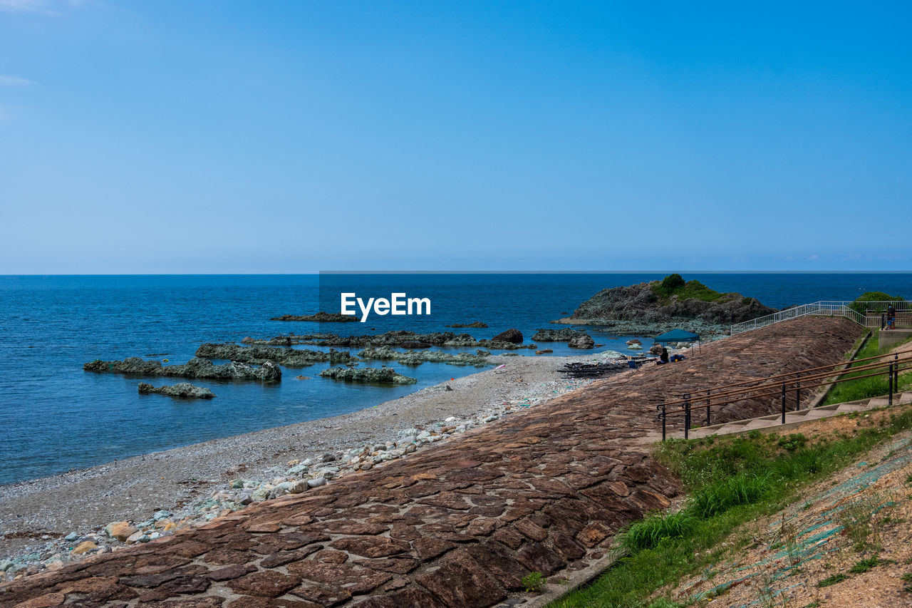 SCENIC VIEW OF BEACH AGAINST CLEAR SKY