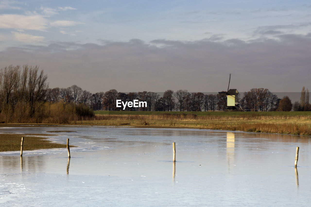 LAKE AGAINST SKY DURING WINTER