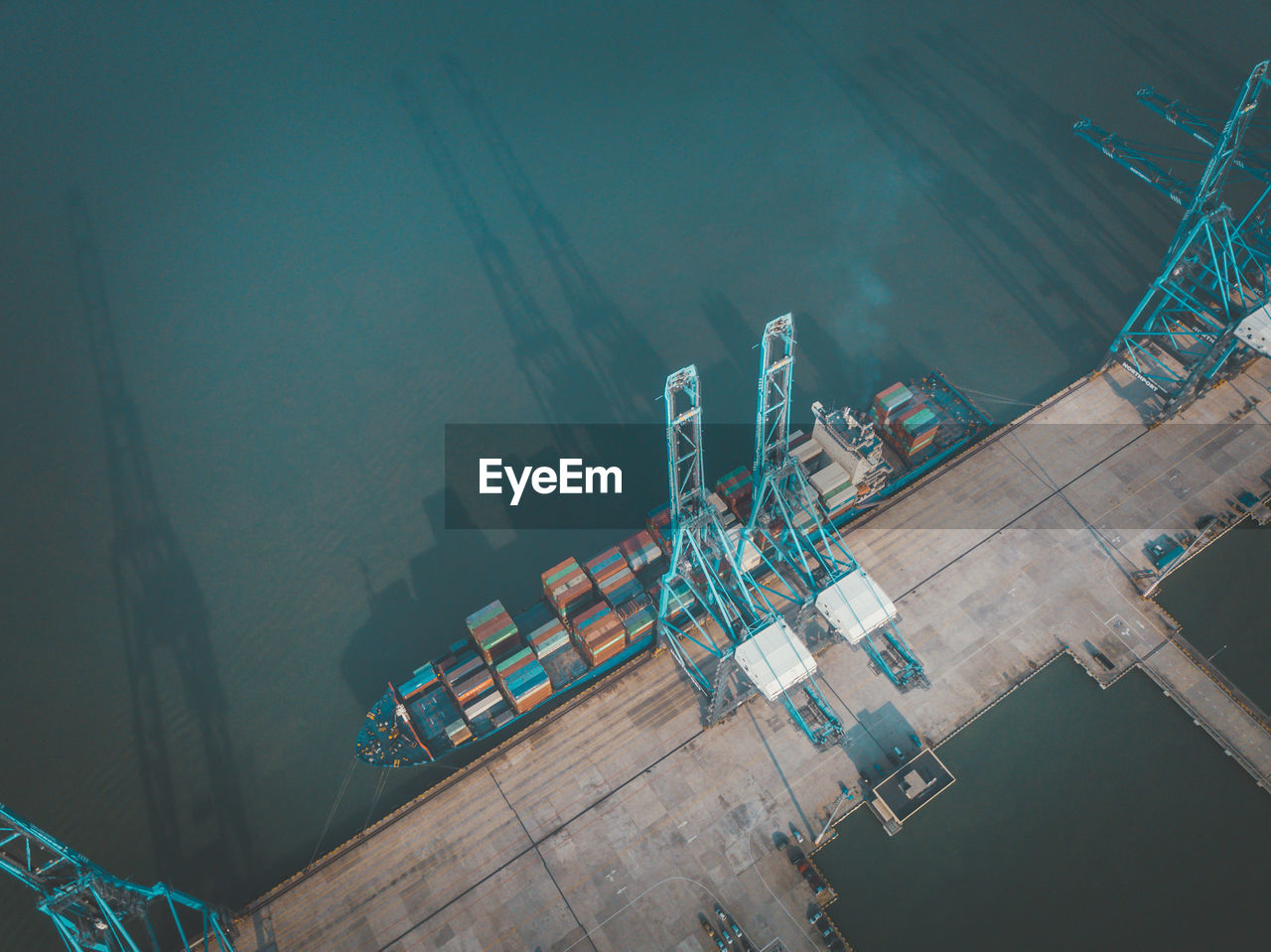 High angle view of commercial dock by sea