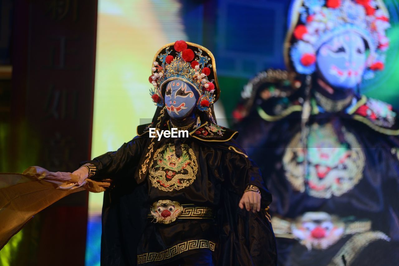 PERSON WEARING MASK ON DISPLAY