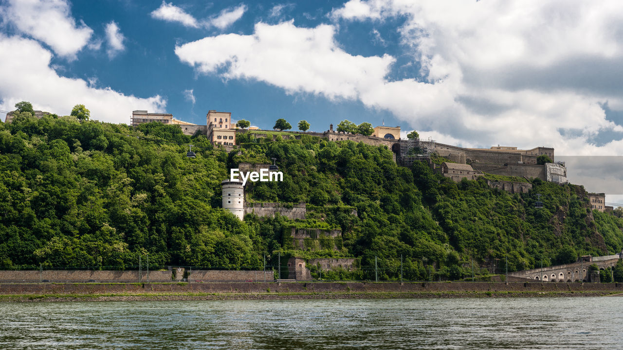 Panoramic view of the ehrenbreitstein fortress on the side of river rhine in koblenz, germany.