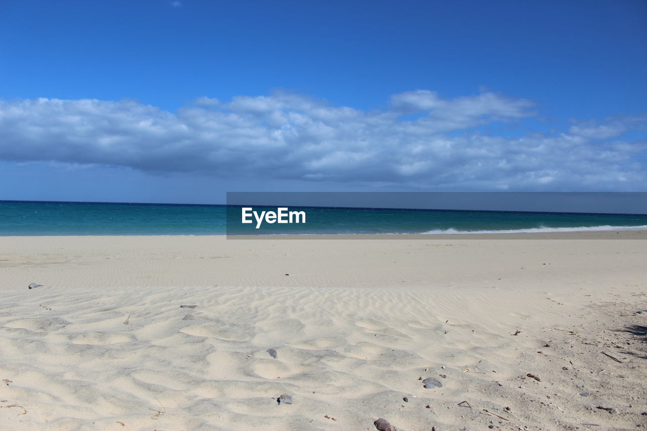 Scenic view of beach against sky