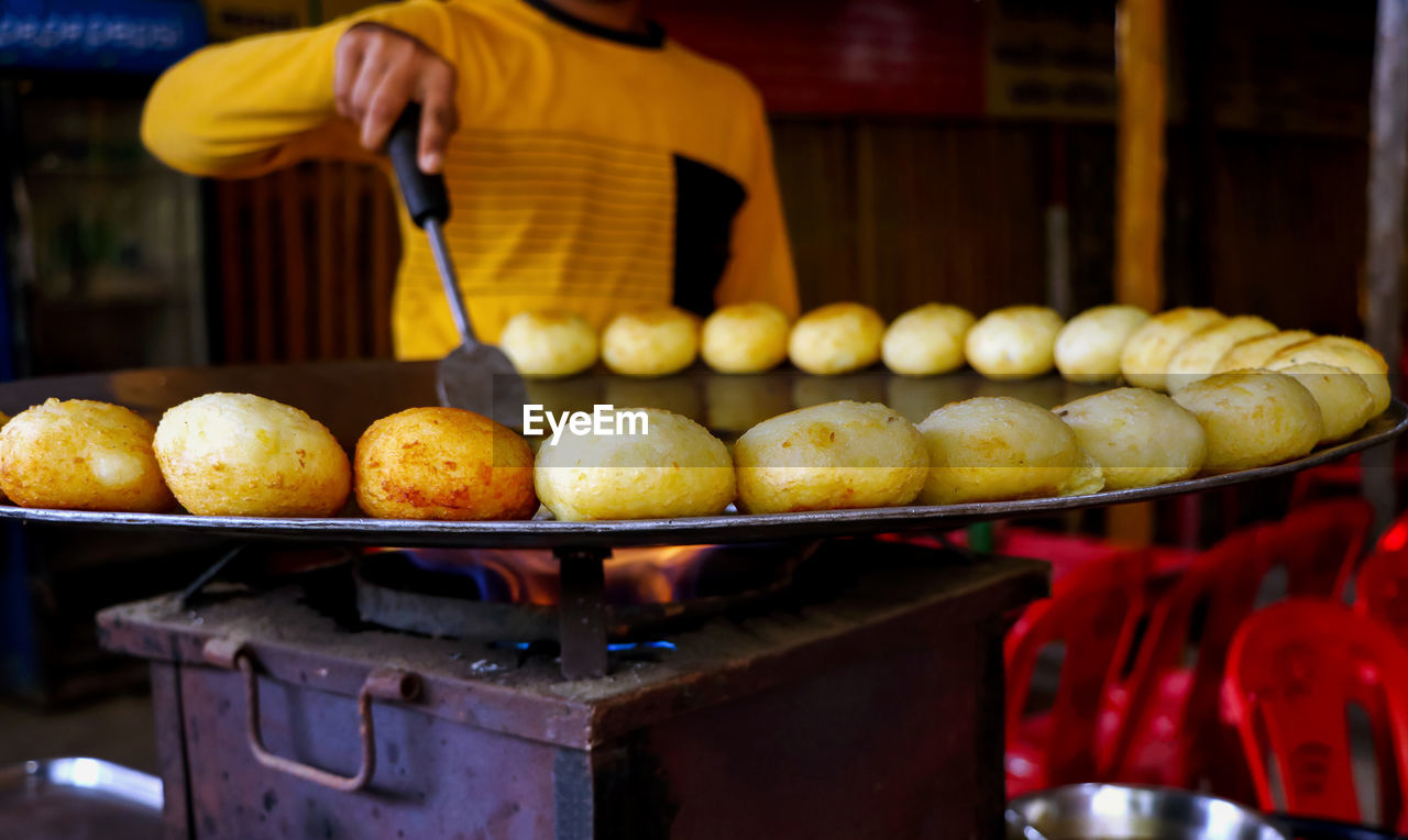 midsection of person preparing food