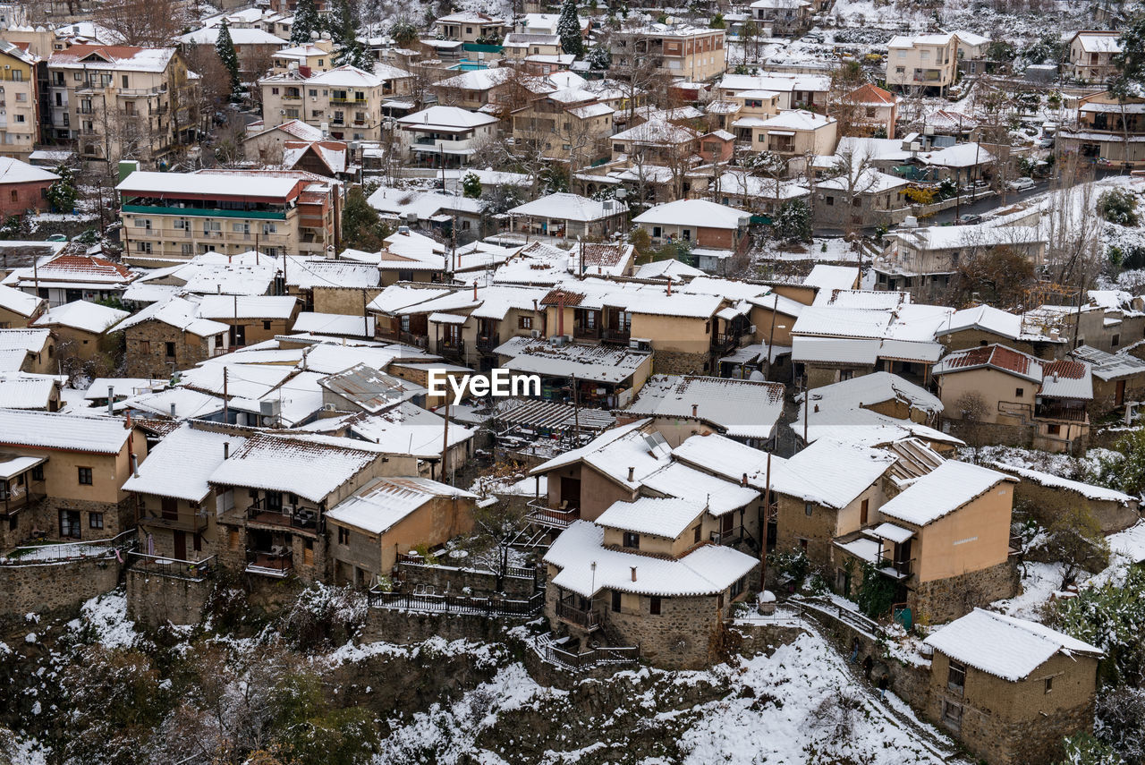 High angle view of snow covered buildings