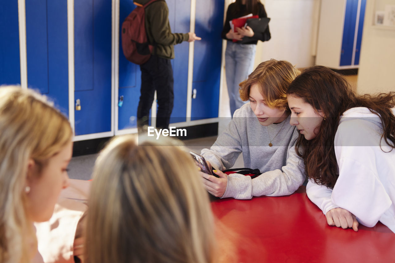 Teenagers in locker room