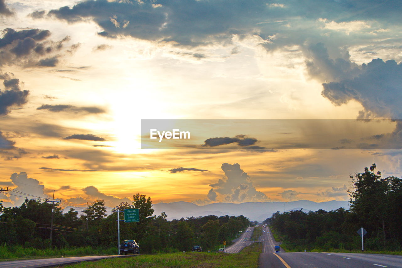 ROAD BY LANDSCAPE AGAINST SKY DURING SUNSET