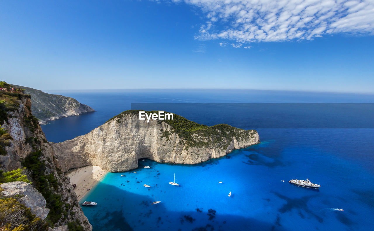 Panoramic view of sea against blue sky