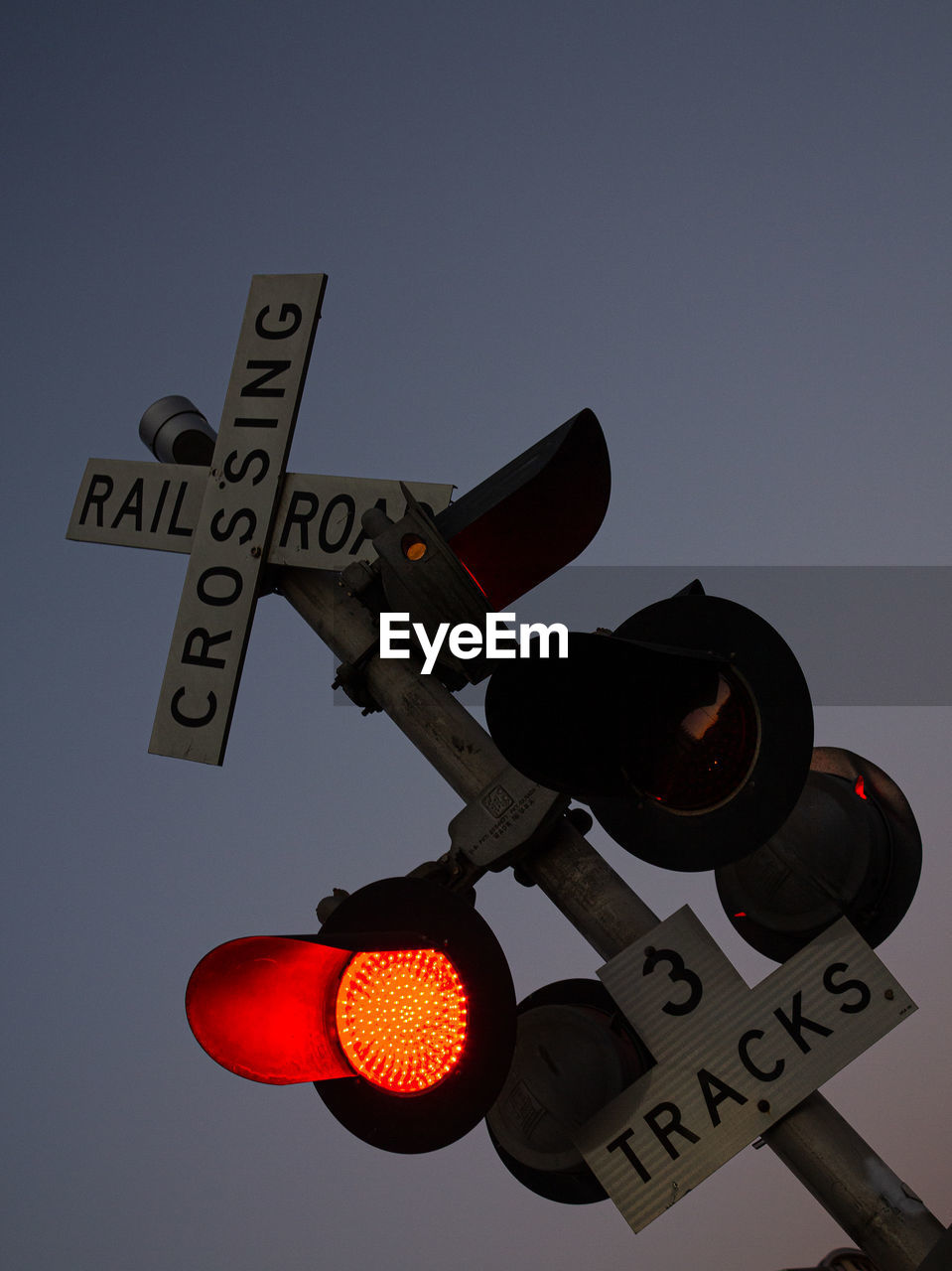 Railroad crossing with red light