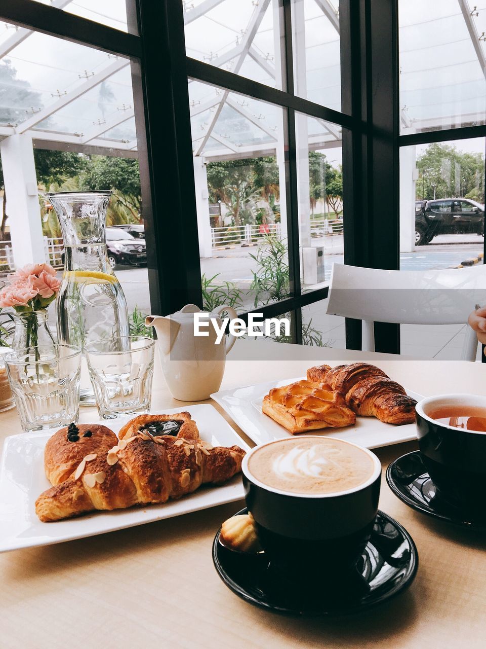 Coffee and breads on table at cafe