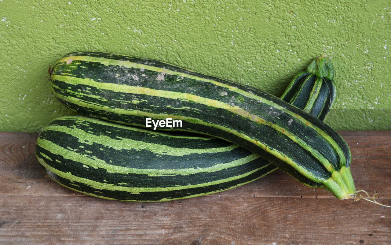 High angle view of green zucchini  on a bench