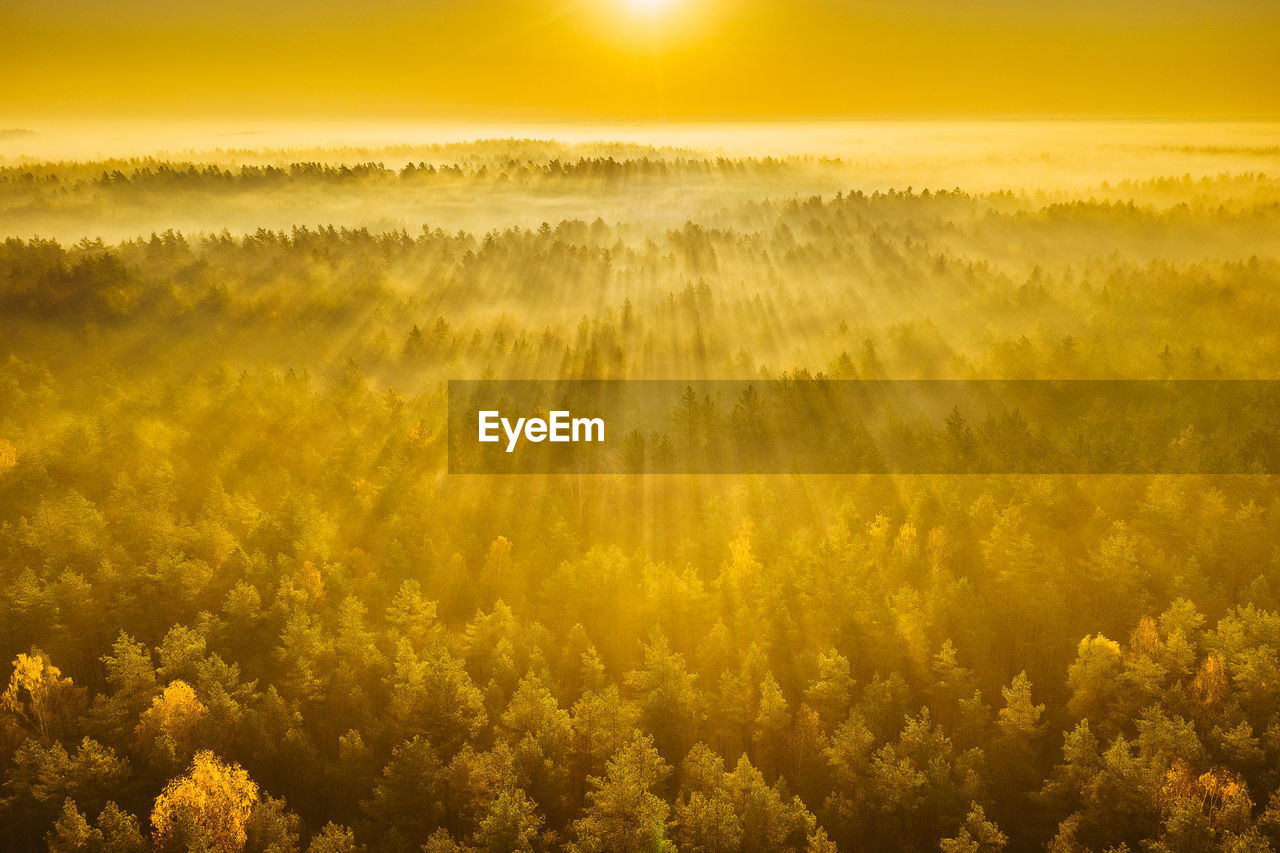 SCENIC VIEW OF LANDSCAPE AGAINST SKY AT SUNSET