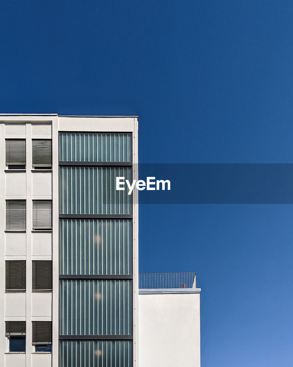 Low angle view of building against clear blue sky