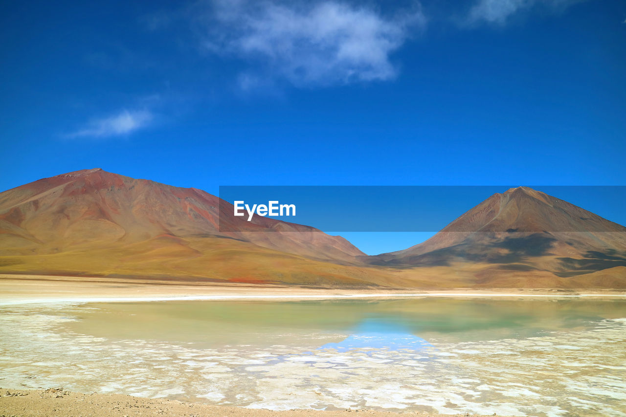 SCENIC VIEW OF MOUNTAINS AGAINST BLUE SKY