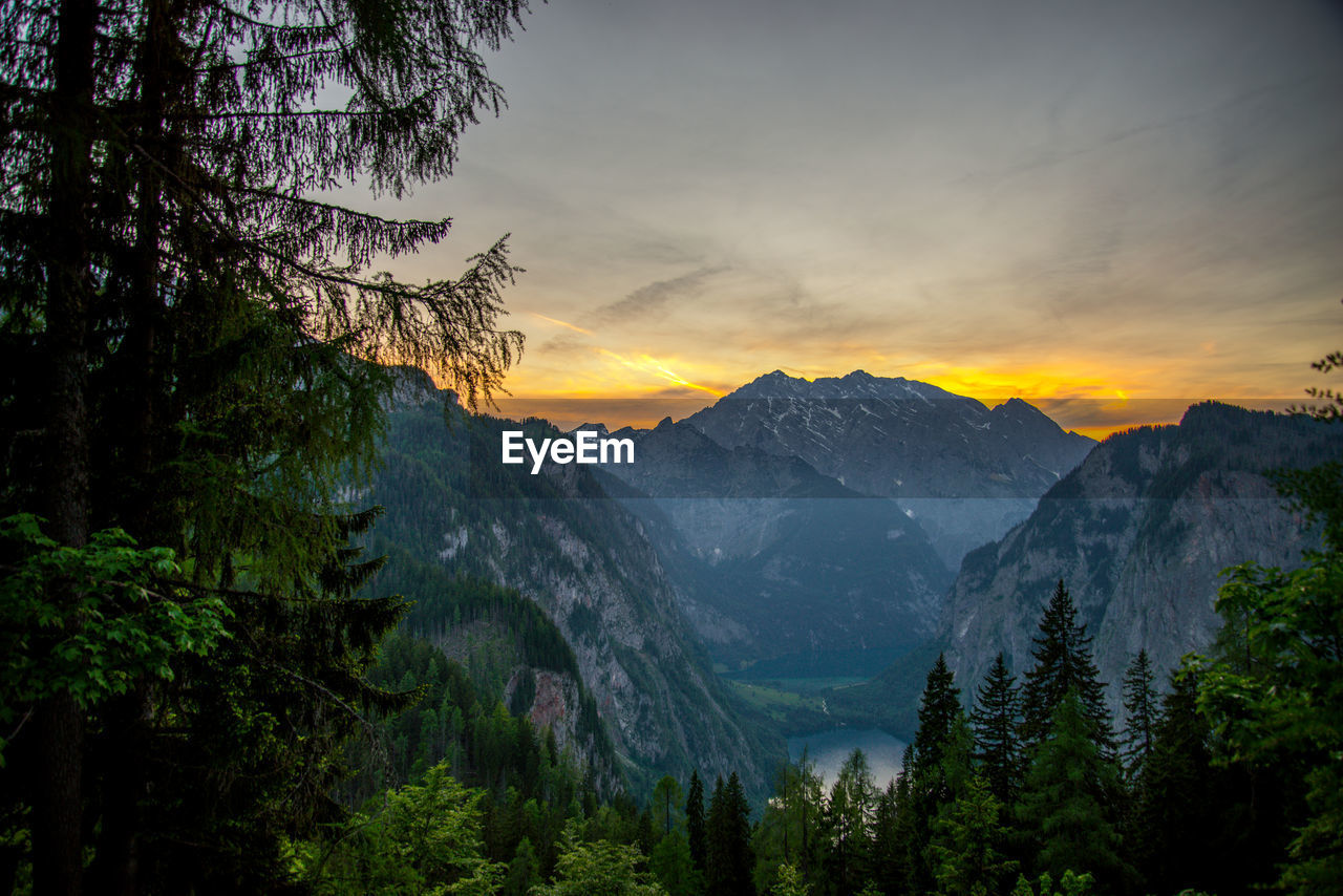 Scenic view of mountains against sky at sunset