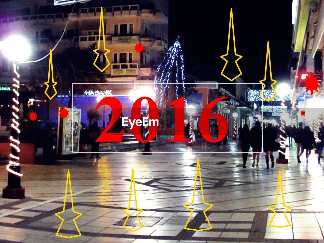 VIEW OF ILLUMINATED STREET AT NIGHT