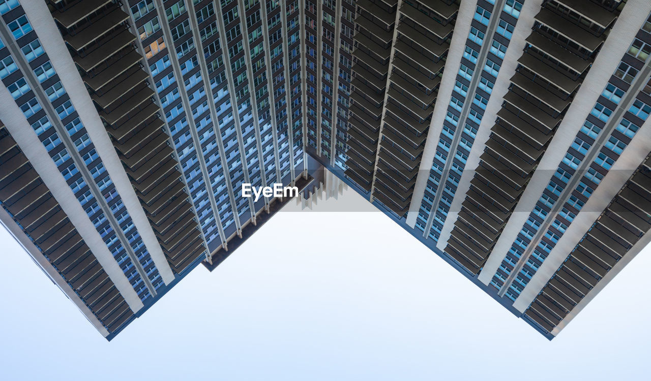 Low angle view of modern buildings against sky