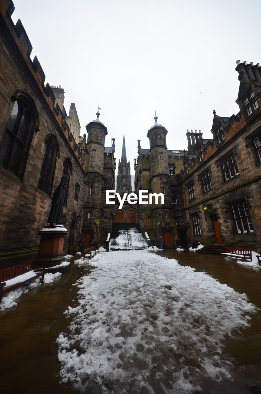 VIEW OF SNOW COVERED BUILDINGS