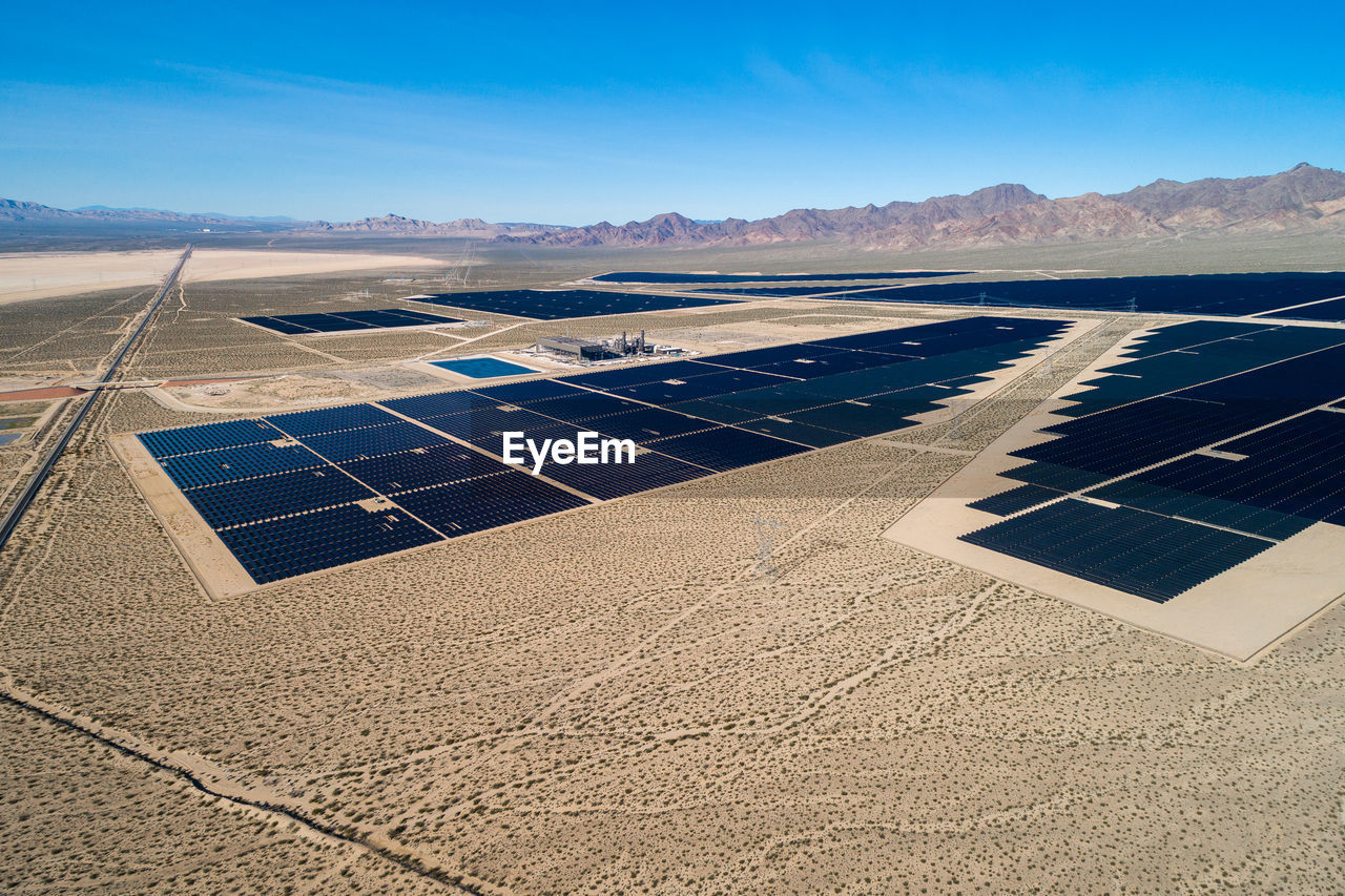 Solar panel produces green, environmentaly friendly energy from the setting sun. aerial view 