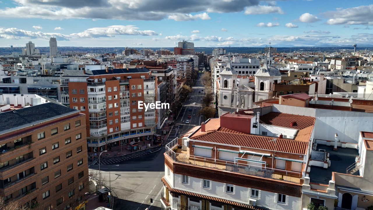 High angle view of buildings in city against sky