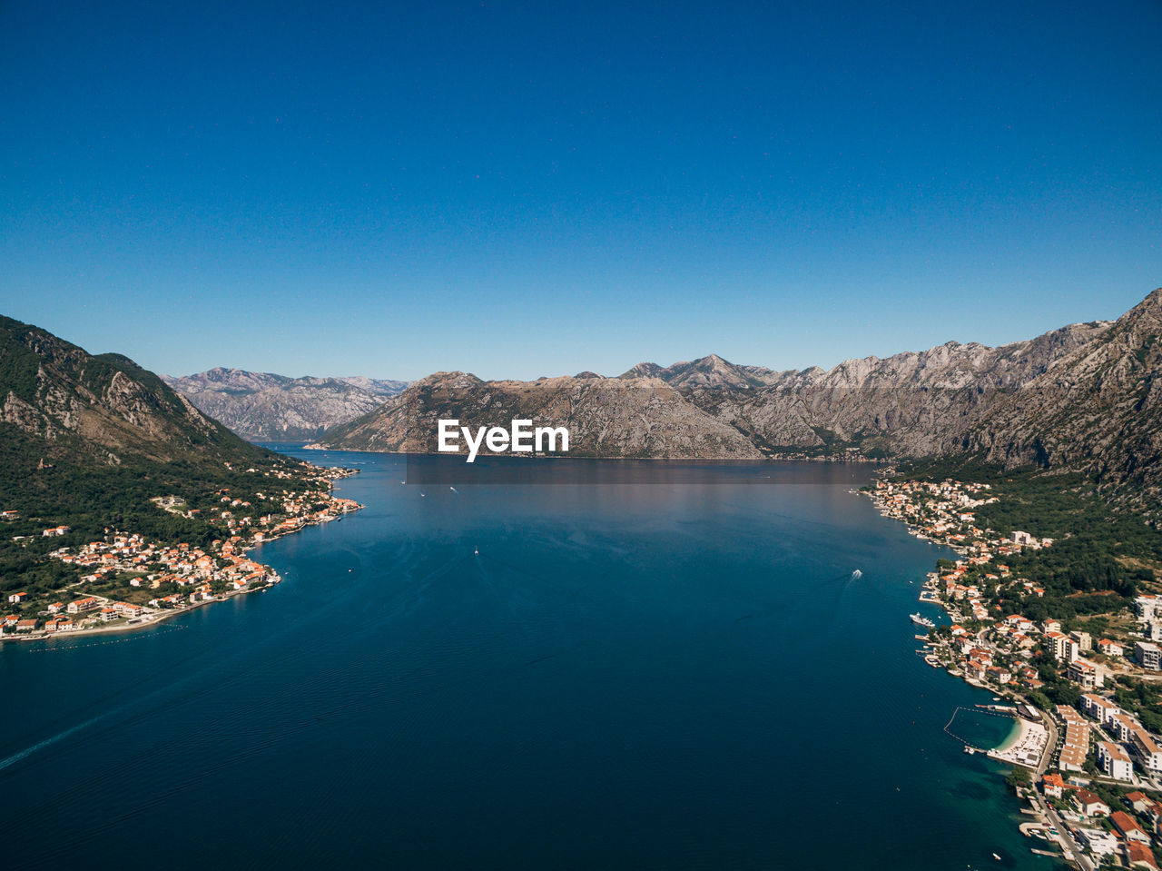 SCENIC VIEW OF LAKE AGAINST BLUE SKY