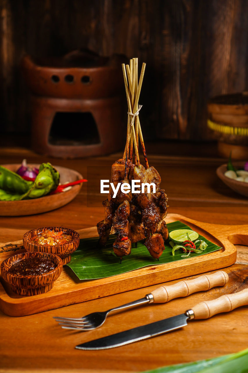 Close-up of chicken satay from indonesia on table