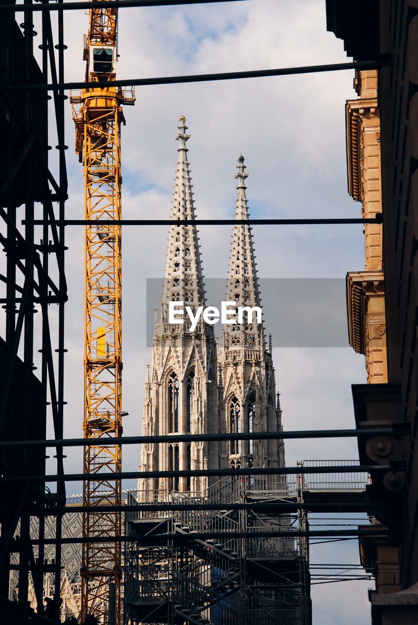 A cathedral in vienna seen through other urban structures, austria