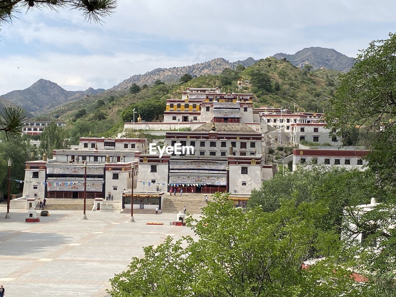 High angle view of monastery and mountains against sky