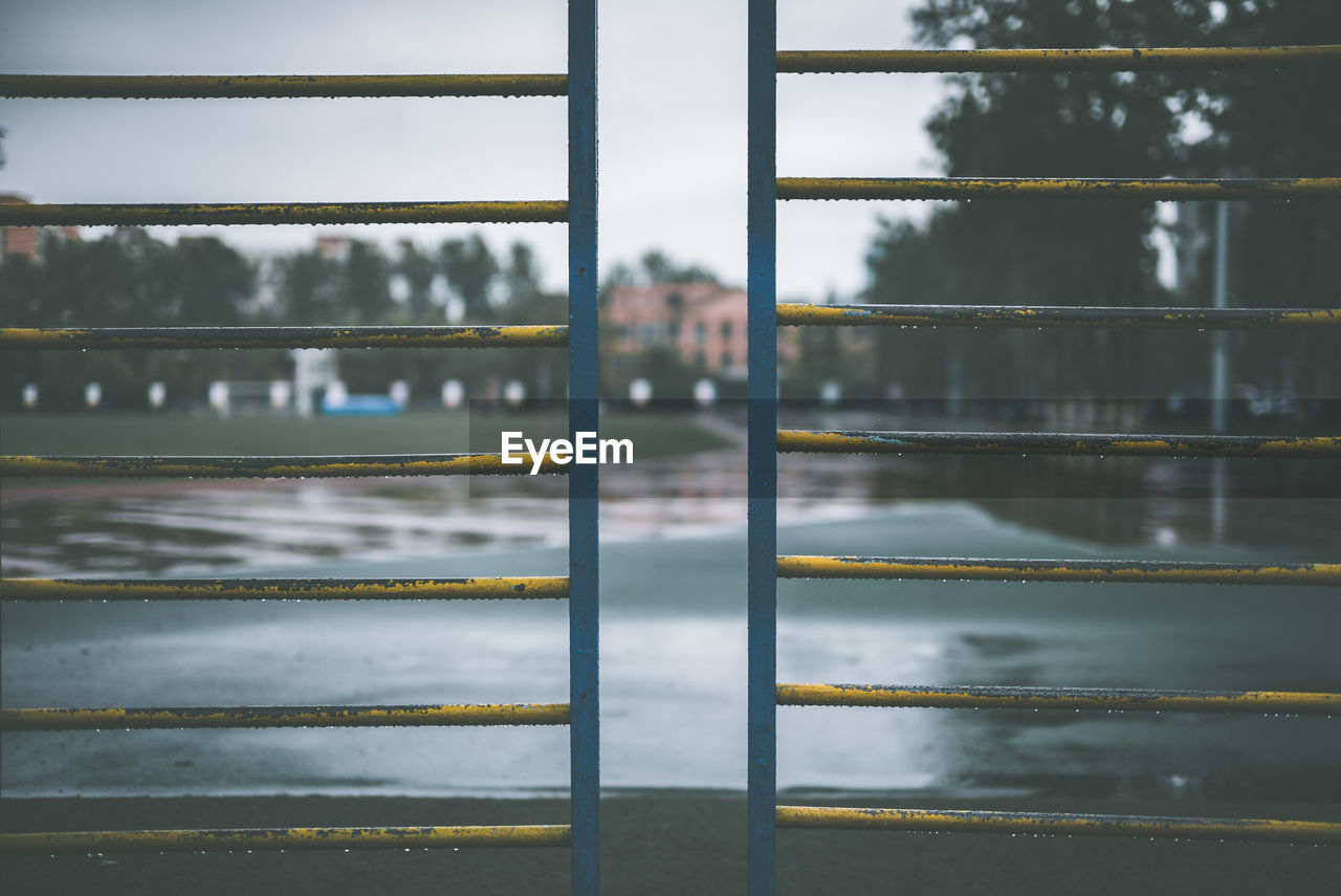 PORTRAIT OF MAN SEEN THROUGH WINDOW