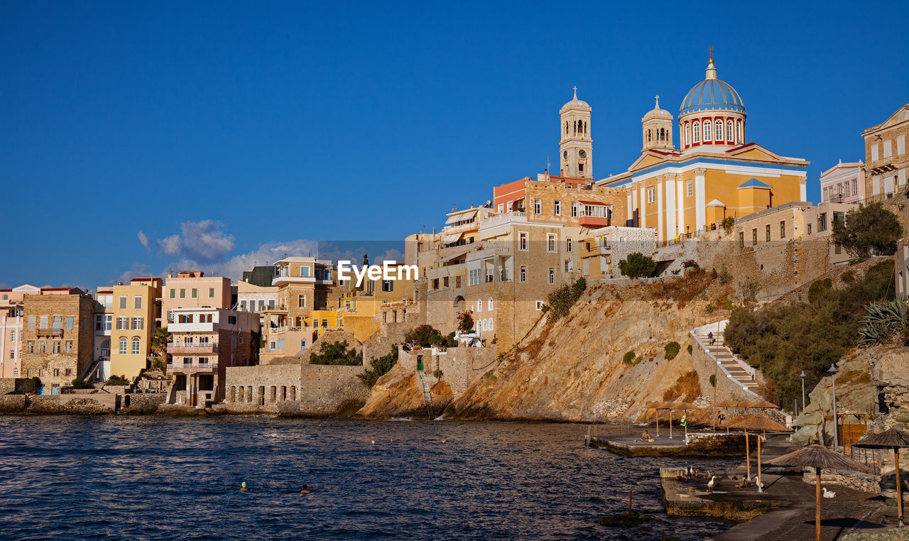 Asteria beach and agios nikolaos church in ermoupoli, syros