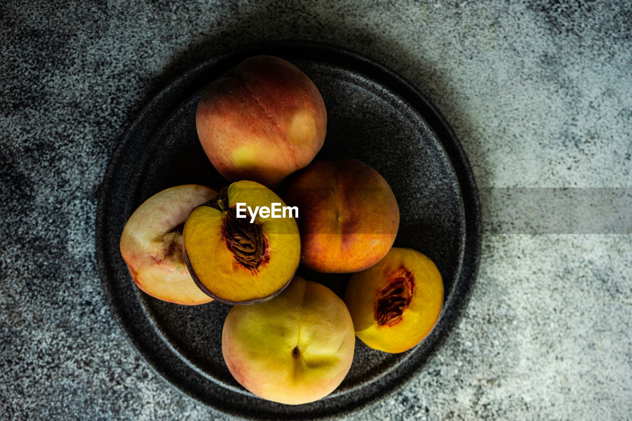 Ripe and healthy peach fruits in the bowl