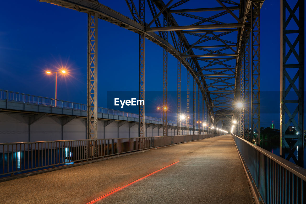 View of bridge against blue sky at night