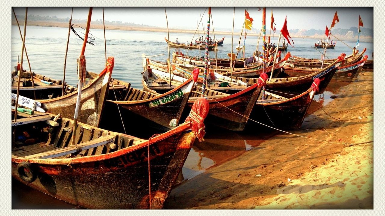 BOATS MOORED IN WATER