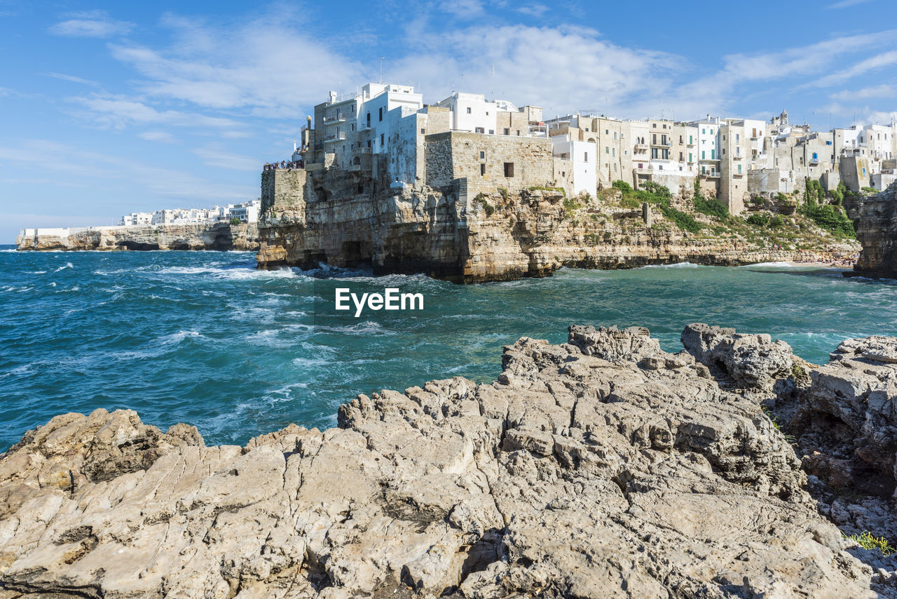 Rough and breathtaking sea. polignano a mare sunlit. puglia. italy