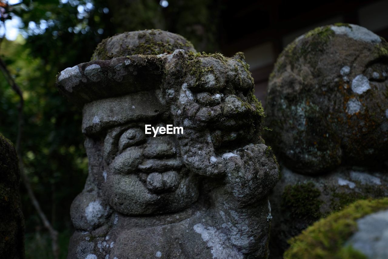 Close-up of statue in cemetery