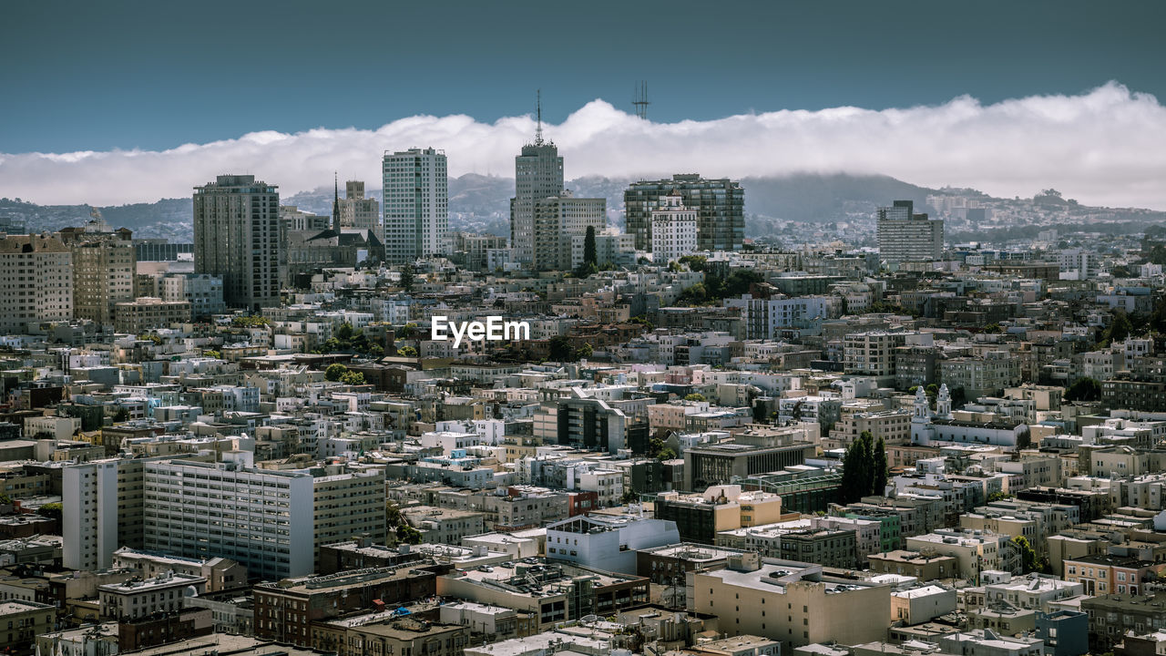 Aerial view of cityscape against sky