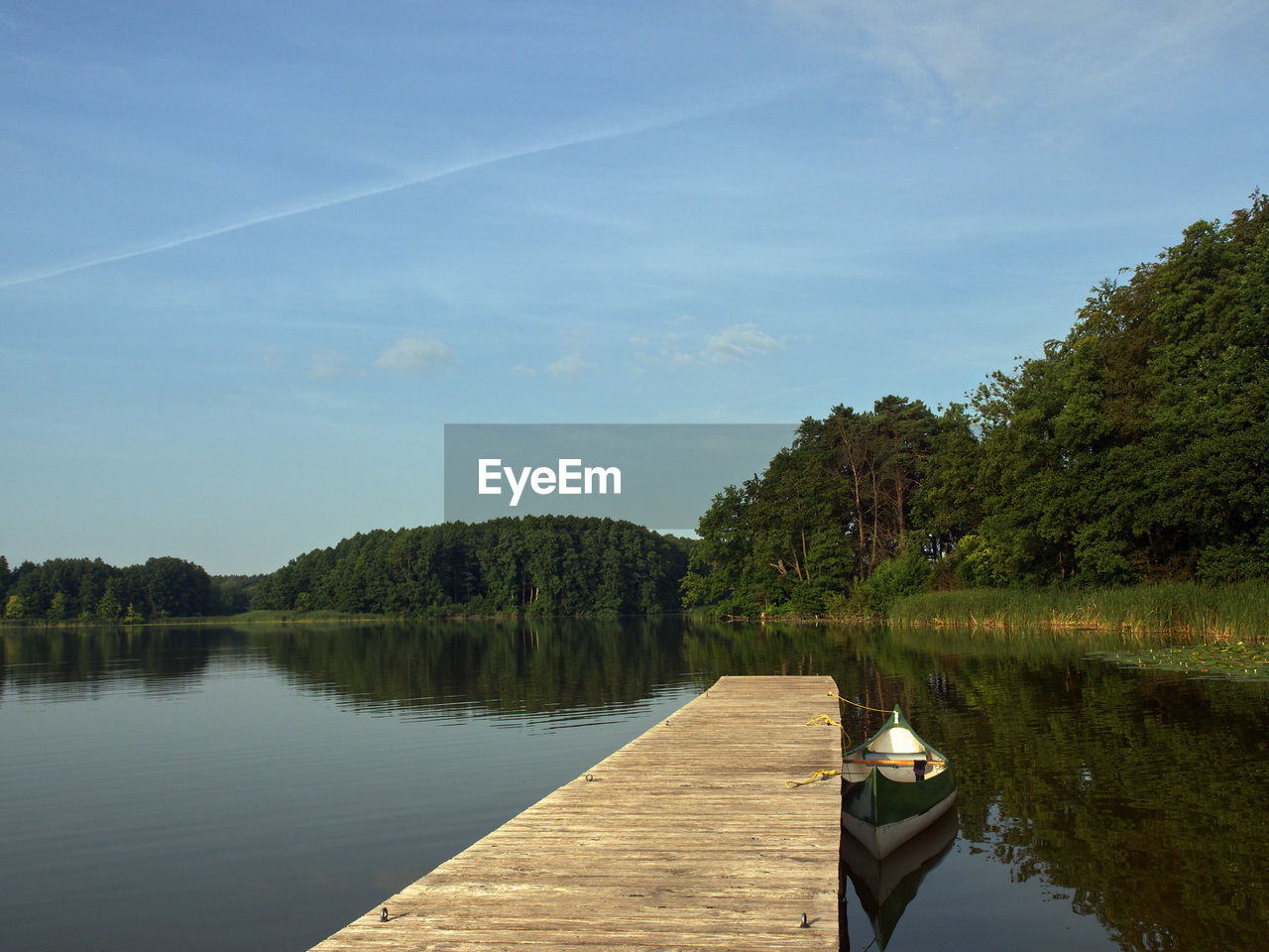 Pier over lake against sky