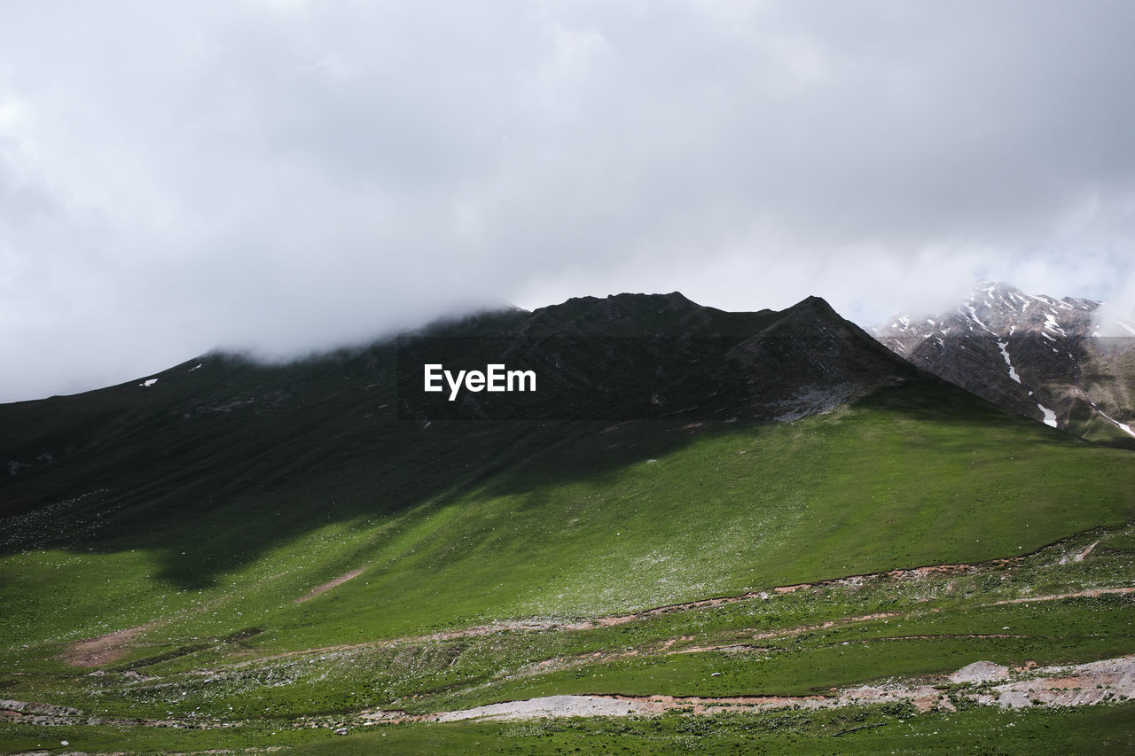 Scenic view of land against sky