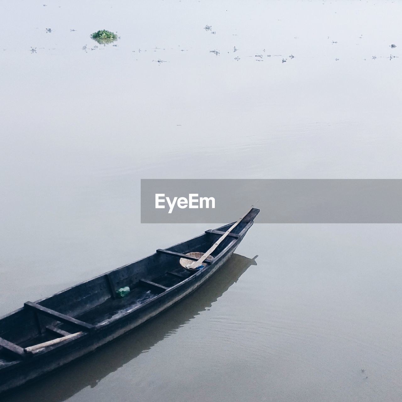 High angle view of boat moored on lake against sky