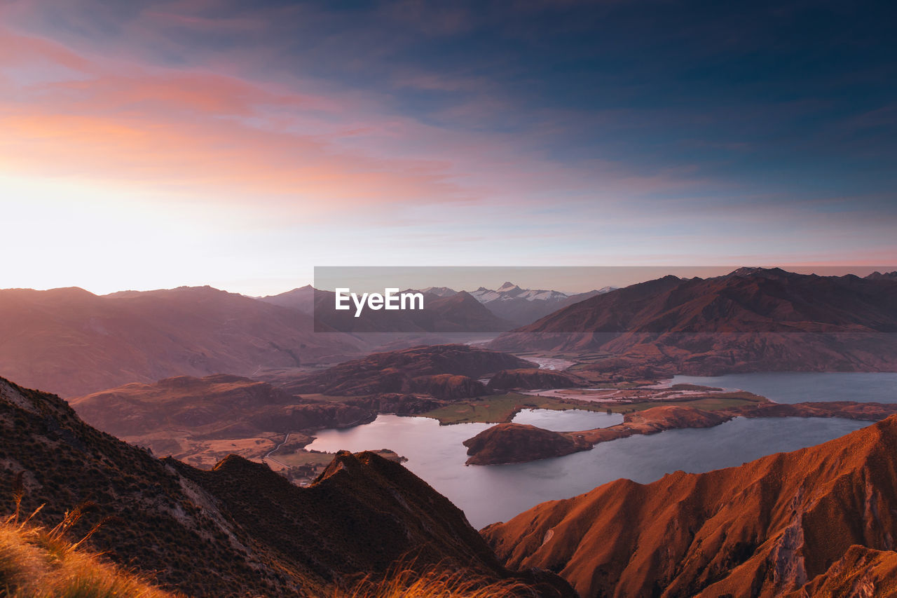 Scenic view of mountains against sky during sunset