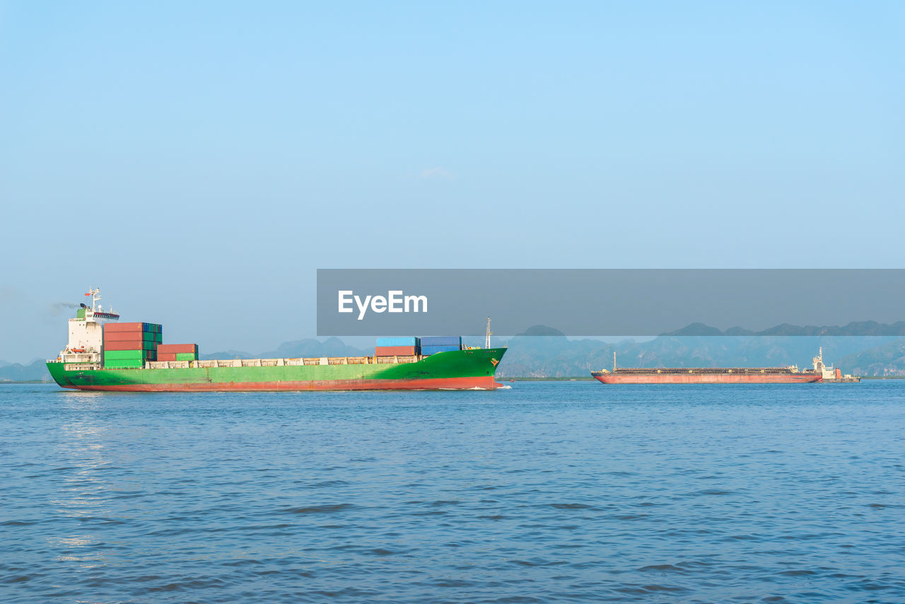 NAUTICAL VESSEL SAILING ON SEA AGAINST CLEAR SKY