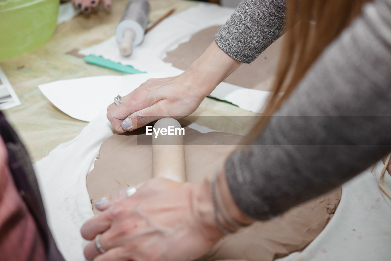 High angle view of people working on table