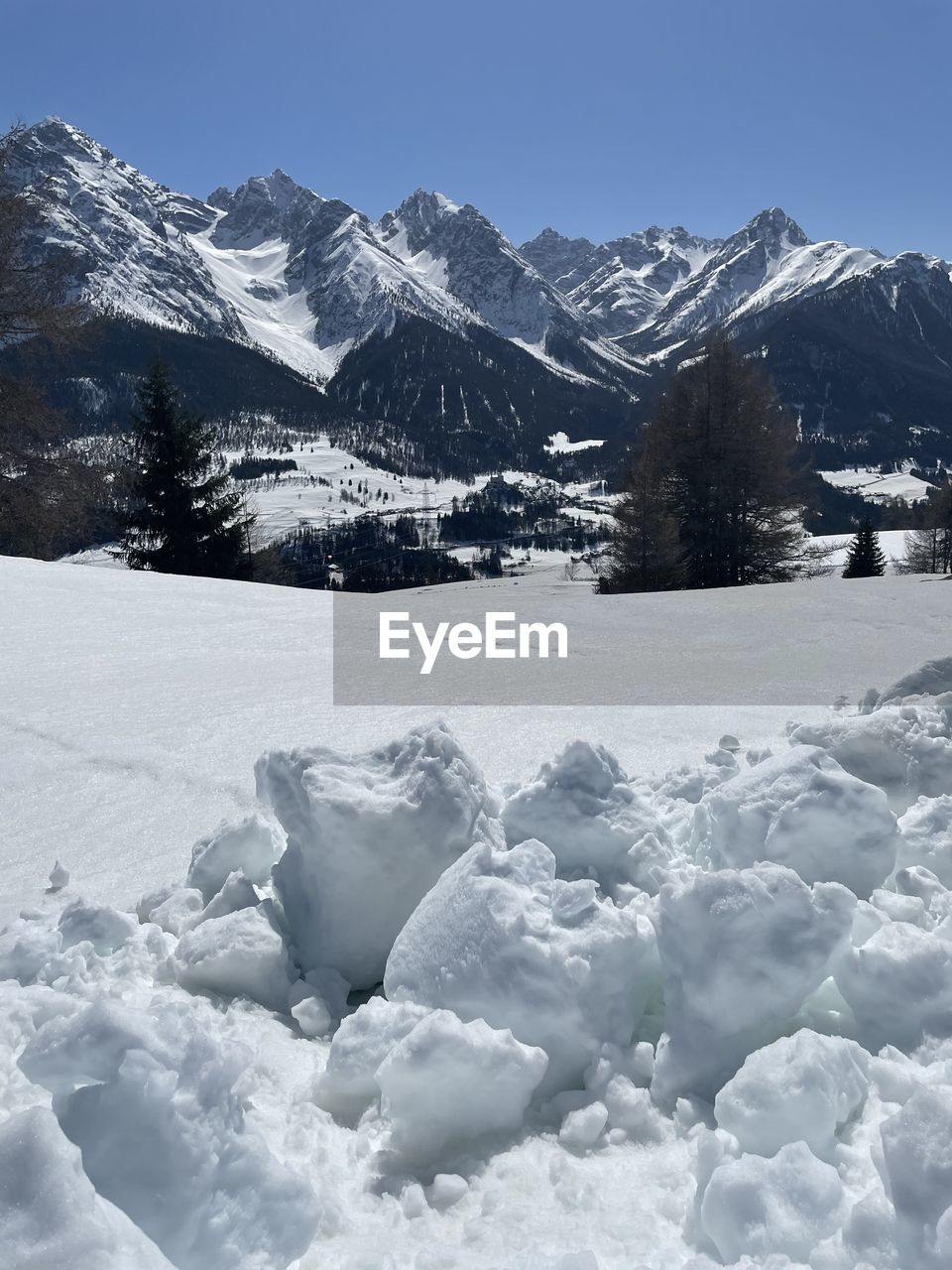 SNOW COVERED LANDSCAPE AGAINST SKY