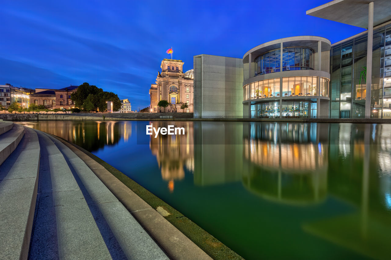 reflection, architecture, water, built structure, building exterior, city, cityscape, night, sky, illuminated, travel destinations, landmark, evening, nature, building, blue, travel, dusk, urban area, no people, twilight, tourism, landscape, river, outdoors, long exposure, waterway, street, cloud, government, bridge, transportation, city life