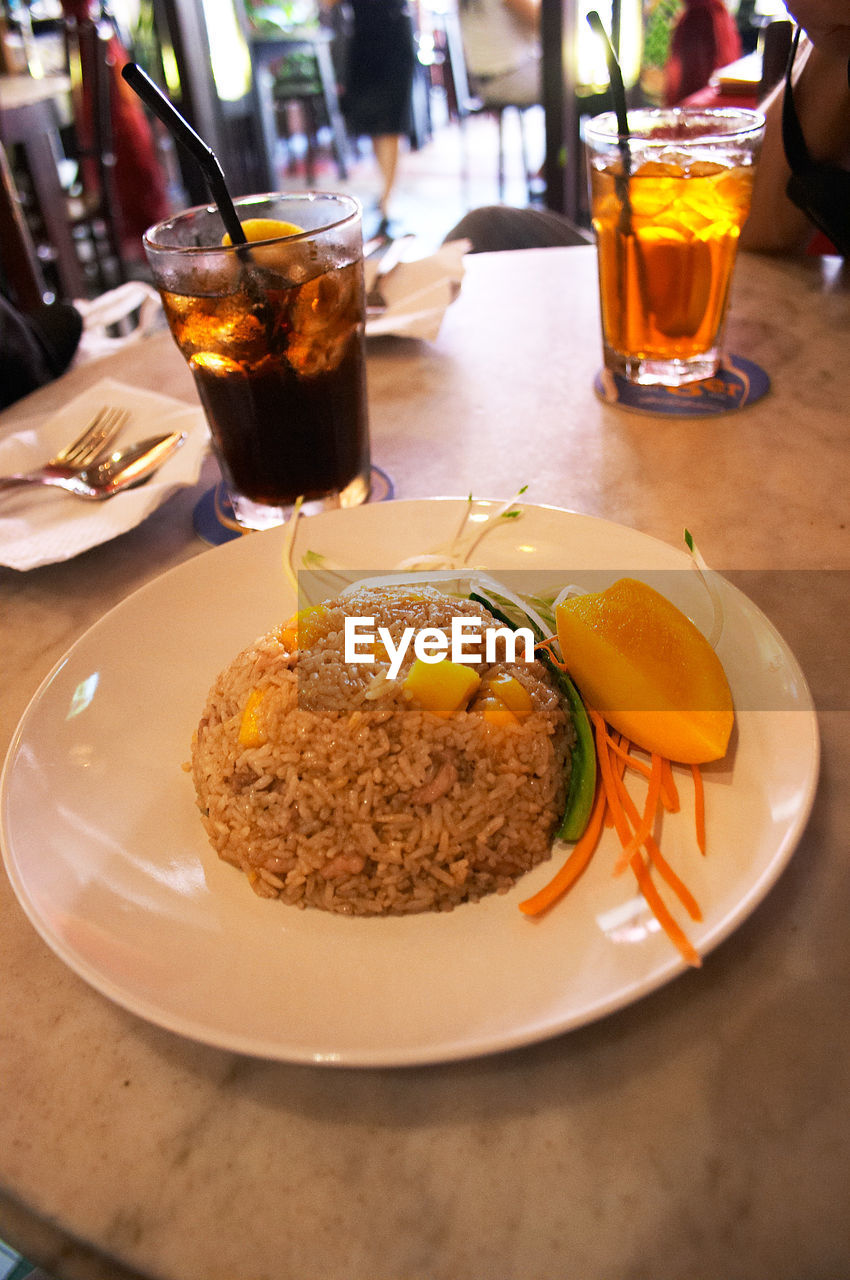 CLOSE-UP OF SERVED FOOD ON TABLE