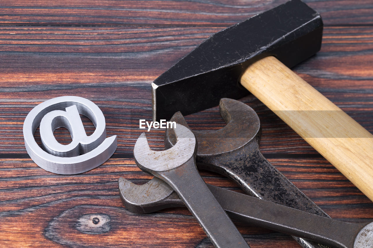 wood, work tool, tool, hand tool, indoors, still life, no people, iron, metal, high angle view, equipment, hammer, studio shot, sharp, table