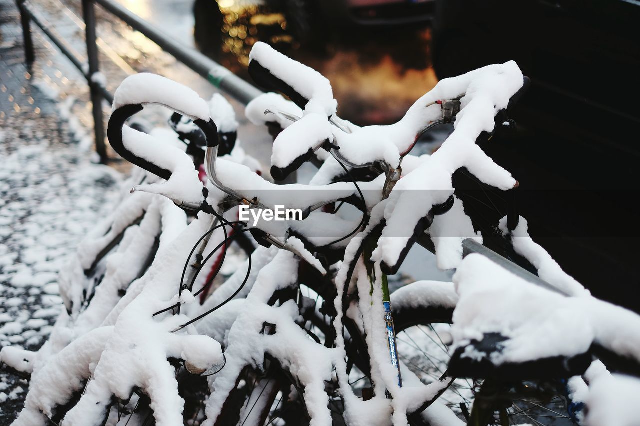 Close-up of frozen bicycles