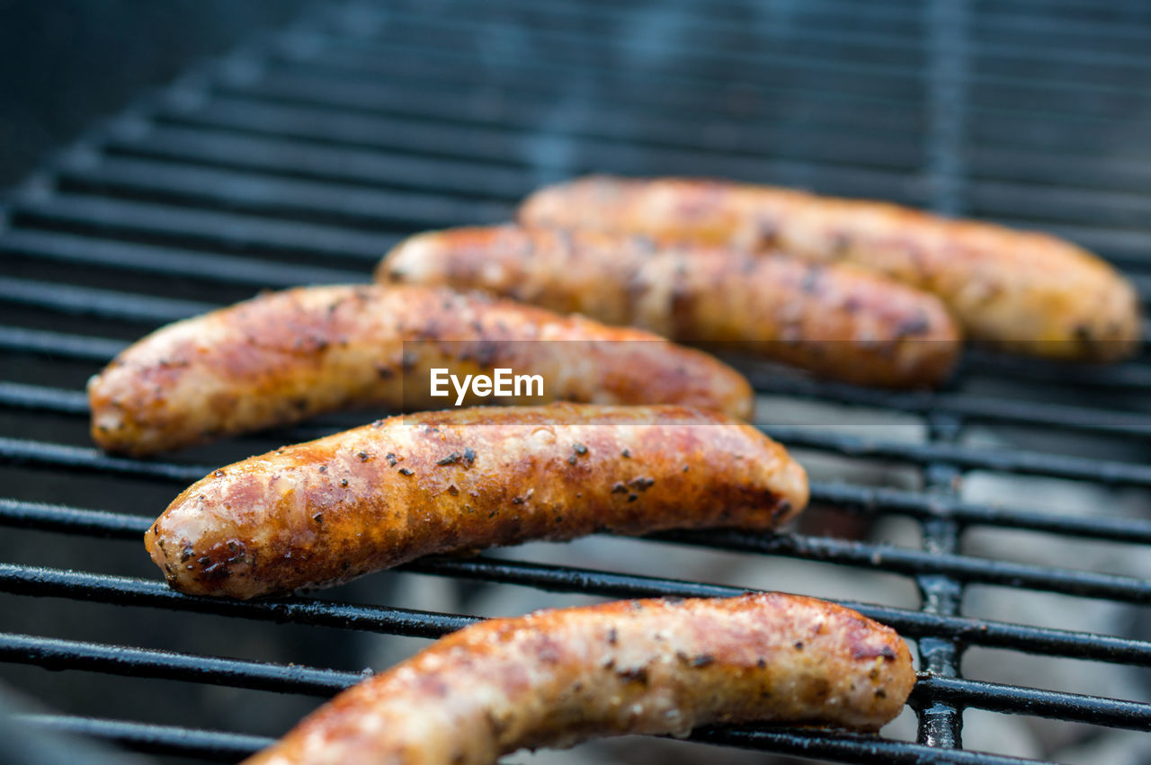 Close-up of sausages on barbecue grill